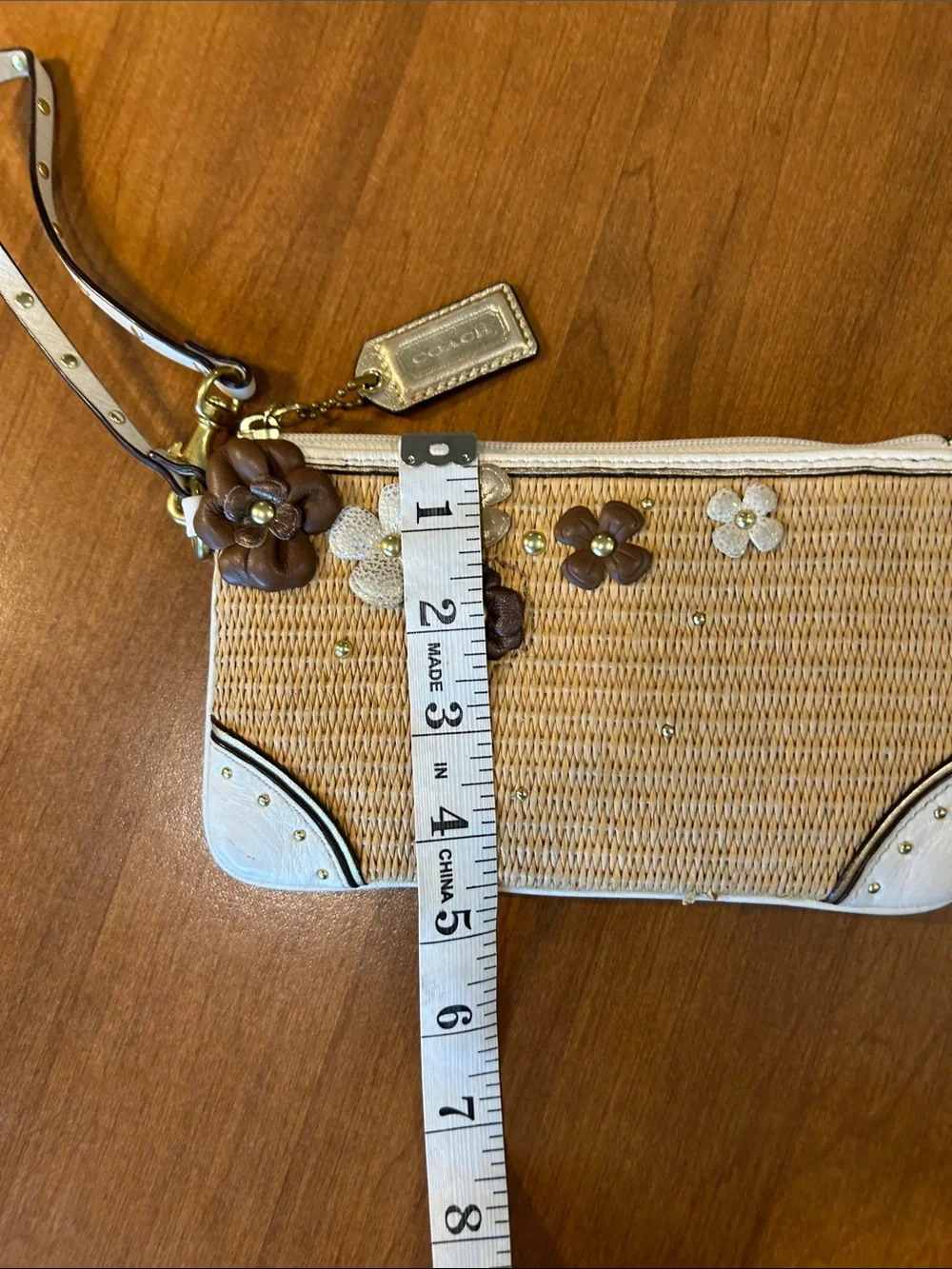 Coach Straw Wristlet with White Trim and Brown Floral Appliqués 2010